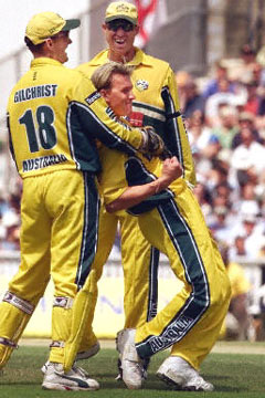 Brett Lee is hugged by Adam Gilchrist and Matthew
                  Hayden after dismissing Darren Gough for a golden
                  duck